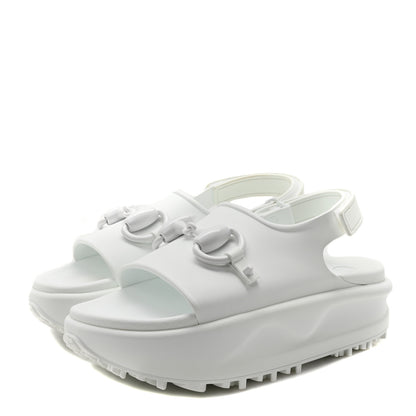 White sandals with a platform sole on a white background