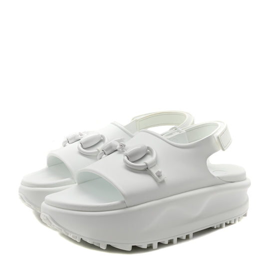 White sandals with a platform sole on a white background